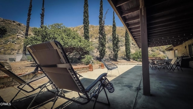 view of patio / terrace featuring a mountain view