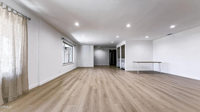 unfurnished living room with light hardwood / wood-style flooring