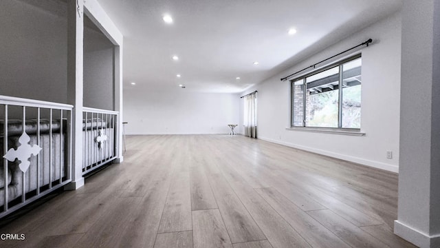 spare room featuring hardwood / wood-style flooring