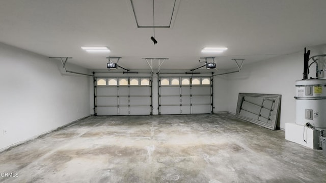 garage featuring a garage door opener and water heater