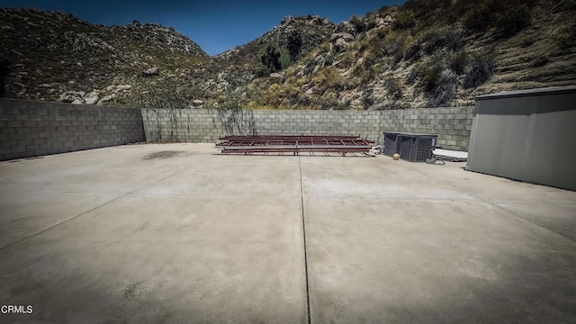 view of patio / terrace featuring a mountain view