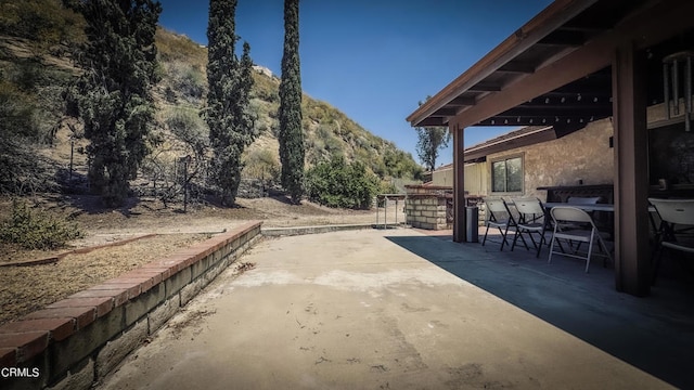 view of patio with a mountain view