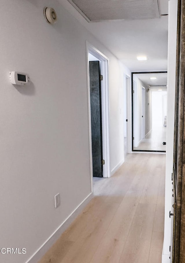 corridor featuring light hardwood / wood-style flooring