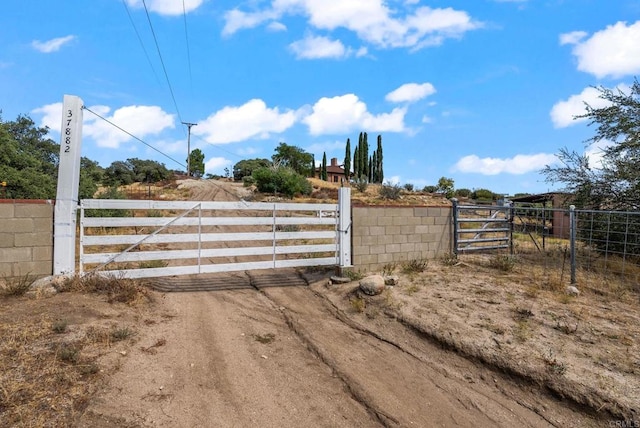 view of gate featuring a rural view