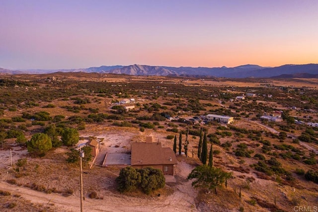 aerial view at dusk with a mountain view