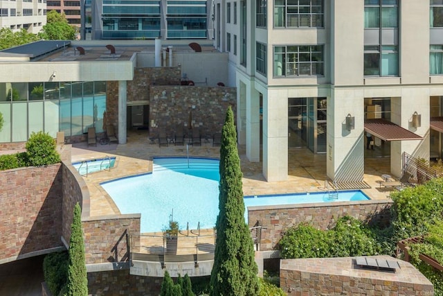 view of swimming pool featuring a patio