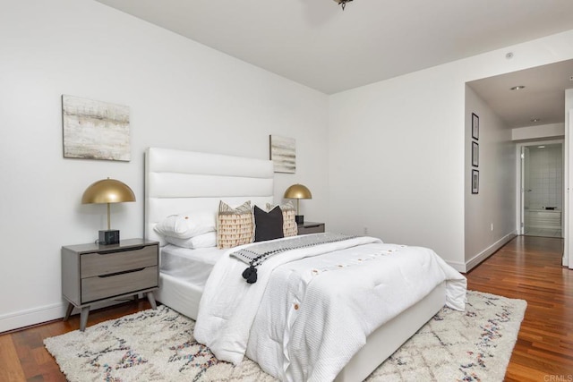 bedroom featuring dark hardwood / wood-style floors