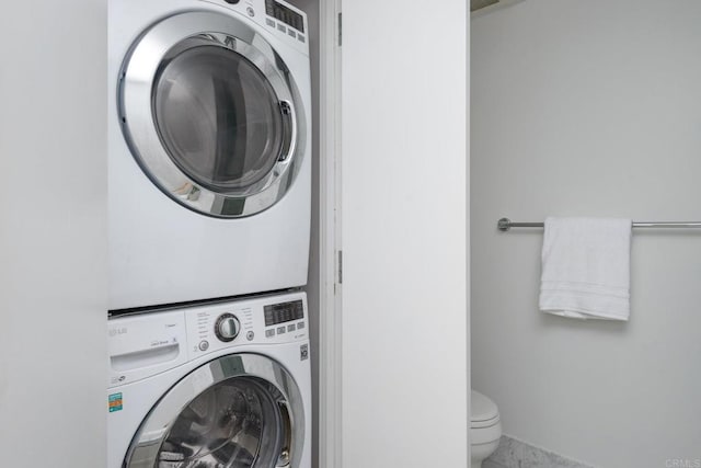 laundry area featuring stacked washer and dryer