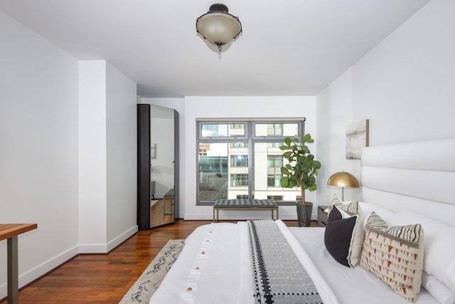 bedroom featuring dark hardwood / wood-style flooring