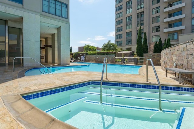 view of swimming pool featuring a patio