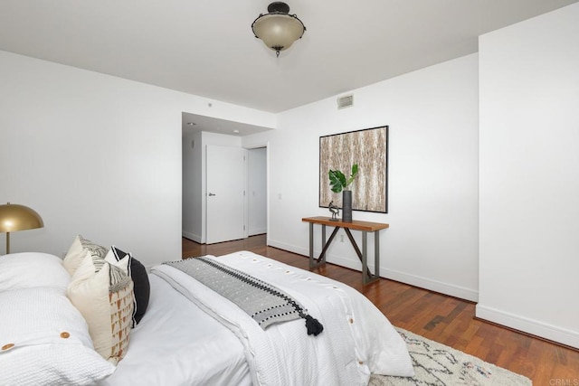 bedroom featuring dark hardwood / wood-style flooring