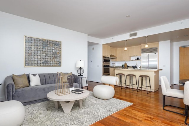 living room with light hardwood / wood-style flooring