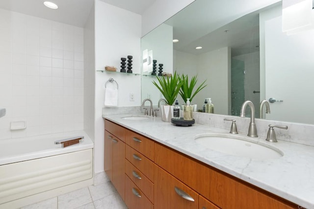 bathroom with plus walk in shower, tile patterned floors, and vanity