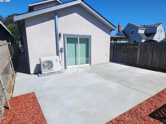 exterior space featuring a patio area and ac unit