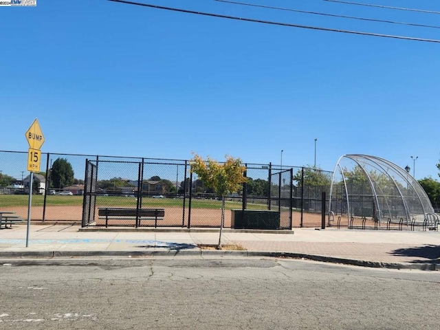 view of playground featuring basketball hoop