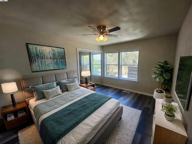 bedroom featuring dark hardwood / wood-style flooring and ceiling fan