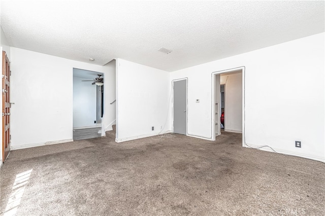 unfurnished bedroom featuring carpet floors and a textured ceiling