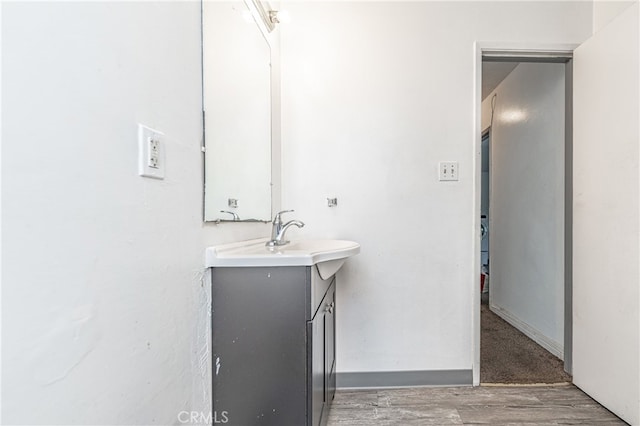 bathroom featuring hardwood / wood-style flooring and vanity