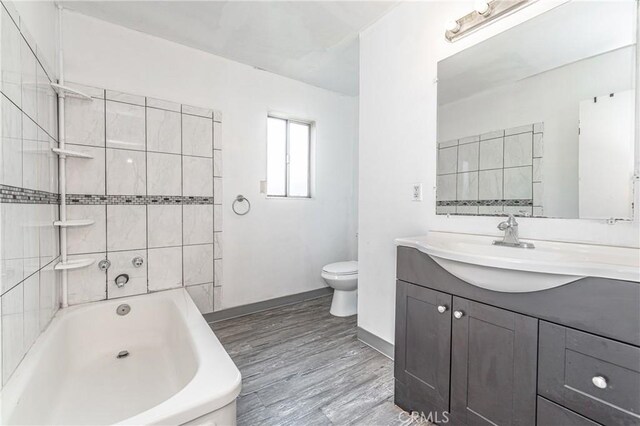 11 Hickock Ln, Carson, CA 90745 - full bath with toilet, vanity, wood finished floors, and baseboards