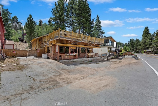 view of front of house with a wooden deck