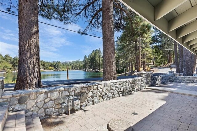 view of patio / terrace with a water view