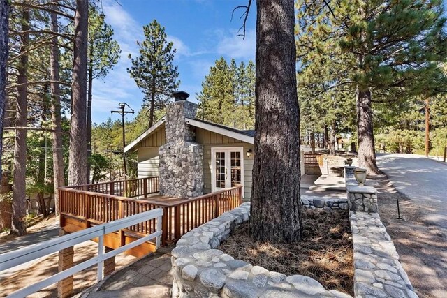 view of home's exterior with french doors and a deck