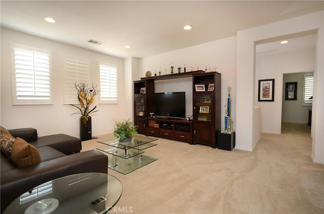 living room featuring light carpet