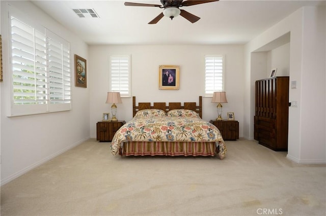 carpeted bedroom with ceiling fan