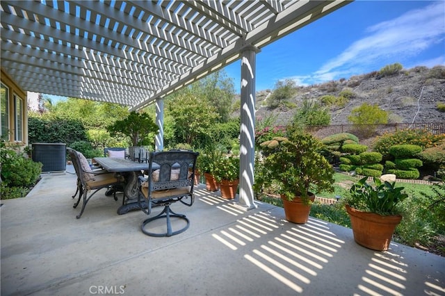 view of patio / terrace with a pergola and cooling unit