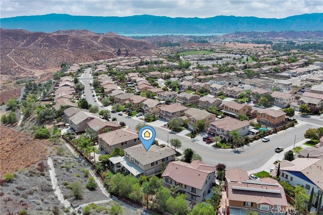 birds eye view of property with a mountain view