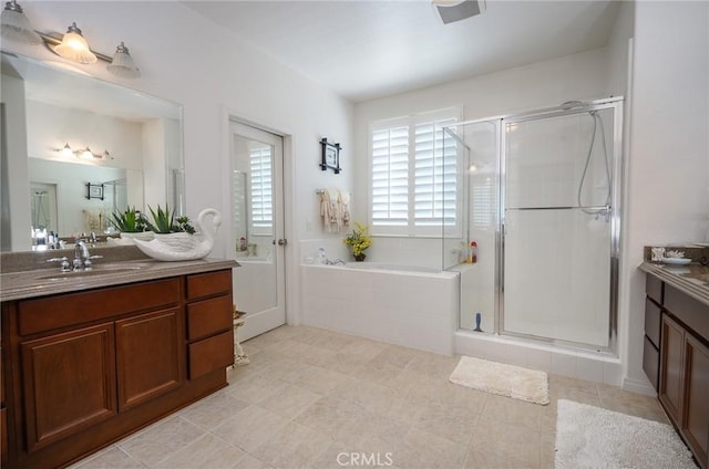 bathroom featuring plus walk in shower and vanity