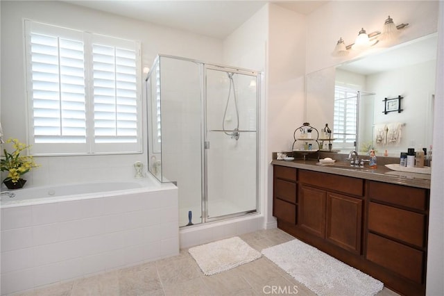 bathroom with separate shower and tub, tile patterned flooring, a wealth of natural light, and vanity