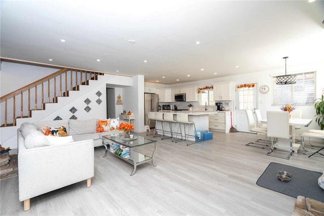 living room with light hardwood / wood-style floors