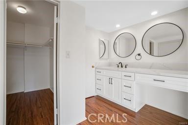 bathroom featuring vanity and wood-type flooring