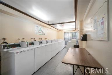 clothes washing area featuring washing machine and clothes dryer