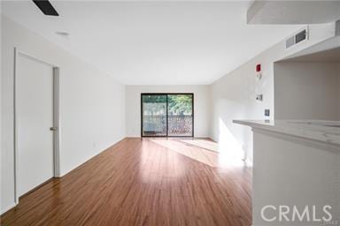 unfurnished living room featuring hardwood / wood-style floors