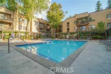 view of swimming pool featuring a patio