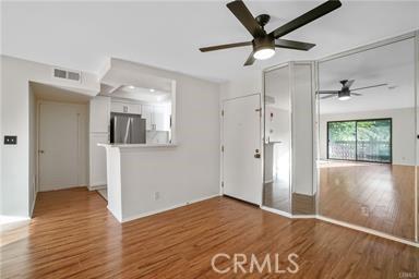 unfurnished living room featuring hardwood / wood-style floors