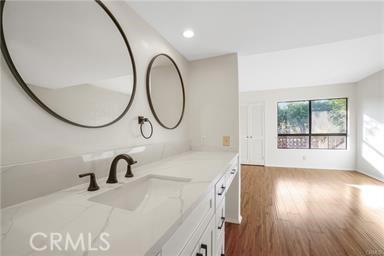 bathroom featuring vanity and hardwood / wood-style flooring