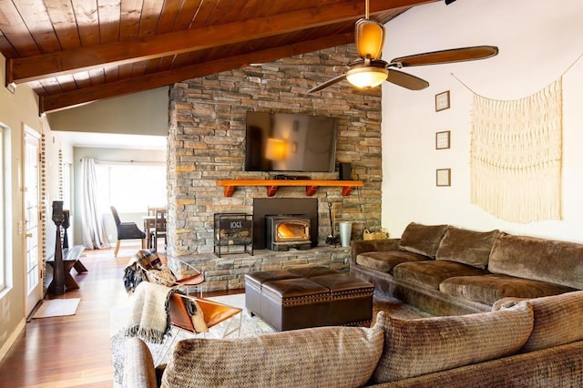 living room with lofted ceiling with beams, ceiling fan, wood ceiling, and light wood-type flooring