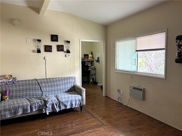 sitting room with vaulted ceiling with beams, dark hardwood / wood-style flooring, and a wall mounted AC