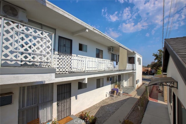 view of property featuring a wall mounted AC