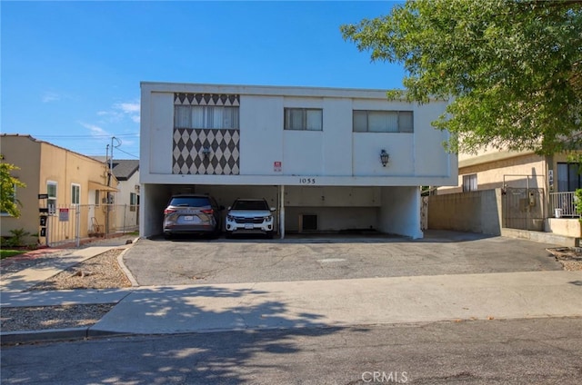 view of front of property featuring a carport