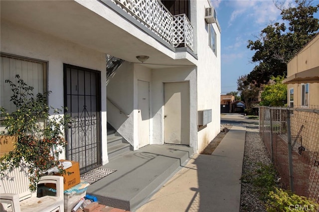 property entrance with a balcony