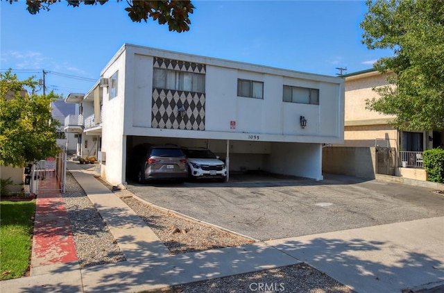 view of front of property featuring a carport