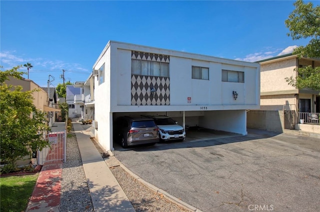 view of building exterior with a carport