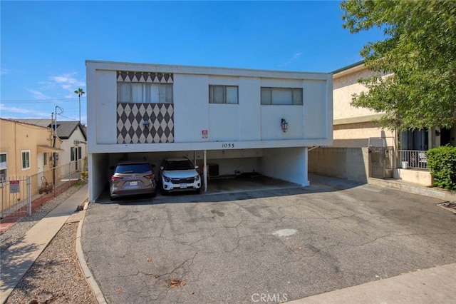 view of front of property with a carport