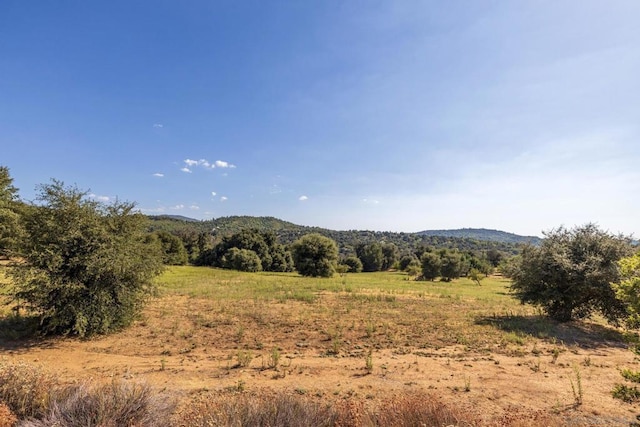 view of mountain feature with a rural view