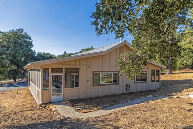 view of front of home featuring a sunroom