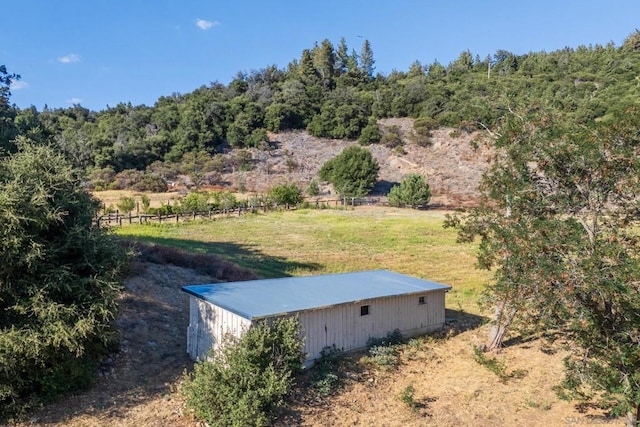 birds eye view of property featuring a rural view